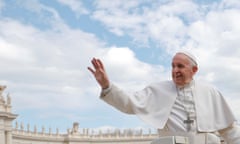 Pope Francis waves in St Peter’s Square in the Vatican.