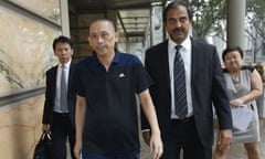 Tan Seet Eng, also known by the nickname of Dan Tan, front left, leaves the supreme court in Singapore Wednesday, Nov. 25, 2015 in Singapore. Tan, who was detained for more than two years under suspicion of being the mastermind behind a global soccer match-fixing syndicate, was ordered to be released on Wednesday by the country's highest court, which ruled he was being held unlawfully. (AP Photo/Ernest Chua/Today via AP)