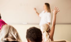 Teacher teaching children in classroom