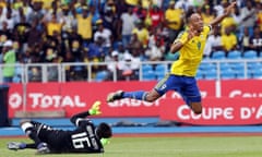 Gabon’s Pierre-Emerick Aubameyang is tripped by Burkina Faso’s goalkeeper Herve Koffi