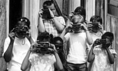 Group portrait of several children taking photographs using Kodak Instamatic cameras, Cincinnati, OH, 1970.