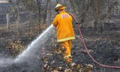 A member of the Country Fire Authority extinguishing a fire.