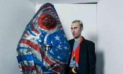 Charles Jeffrey alongside a model wearing a giant fish costume