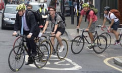 London mayor Boris Johnson with a group of cyclists on suburban road