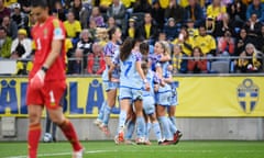 Mariona Caldentey celebrates with teammates after scoring Spain’s third goal from the penalty spot against Sweden.