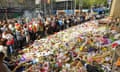 A smoking ceremony is held before the floral memorial on Bourke Street, Melbourne, is removed on Tuesday.