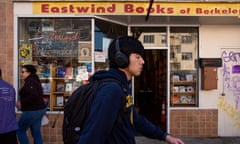 A man walks past shop front of Eastwind books