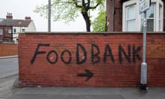 UK Food Bank Graffiti<br>A wall covered by bold, black graffiti that points towards a local food bank in Harehills, one of the most deprived areas of Leeds, as charity the Trussell Trust warns that the country's ongoing cost of living crisis could lead to a sharp uptick in households relying on parcels from food banks on 2nd May, 2022 in Leeds, United Kingdom. Household budgets across the UK have been hit hard by rising costs of food, fuel, and energy, pushing some into poverty. (photo by Daniel Harvey Gonzalez/In Pictures via Getty Images)