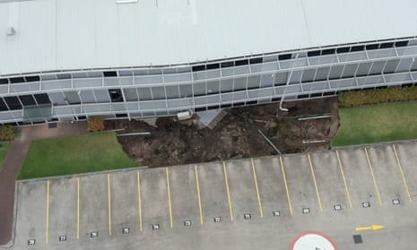 Drone vision shows sinkhole beneath Sydney building – video