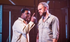 Danny Sapani as Tshembe and Elliot Cowan as Charlie in Les Blancs by Lorraine Hansberry @ Olivier, National Theatre. Directed by Yael Farber.