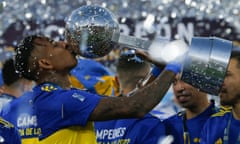 Boca Juniors celebrate with the trophy after winning the 2022 Copa de la Liga final.