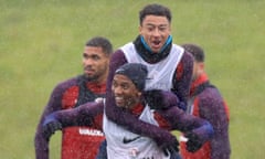 Ashley Young, bottom, enjoys a laugh with Jesse Lingard during an England training session.