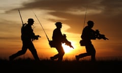 British soldiers on patrol at sunset