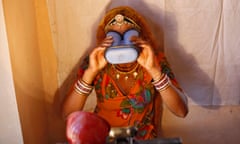 A villager goes through the process of eye scanning for UID database system at an enrolment centre at Merta district in Rajasthan<br>A villager goes through the process of eye scanning for Unique Identification (UID) database system at an enrolment centre at Merta district in the desert Indian state of Rajasthan February 21, 2013.In a more ambitious version of programmes that have slashed poverty in Brazil and Mexico, the Indian government has begun to use the UID database, known as Aadhaar, to make direct cash transfers to the poor, in an attempt to cut out frauds who siphon billions of dollars from welfare schemes. Picture taken February 21, 2013. REUTERS/Mansi Thapliyal (INDIA - Tags: BUSINESS SOCIETY POVERTY SCIENCE TECHNOLOGY)