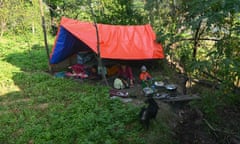 A family in a makeshift tent in a rural setting in Nepal