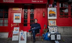 Artist Jerome Feugueur waits for customers at Place du Tertre in Montmartre. It would normally be bustling with tourists, even in January. 