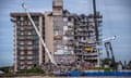 In this file photo Search and Rescue teams look for possible survivors in the partially collapsed 12-story Champlain Towers South condo building on June 30, 2021 in Surfside, Florida. - The death toll in last month's collapse of a Florida apartment building has now risen to 90, officials said on July 11, 2021, with another 31 people still unaccounted for after the tragedy. Champlain Towers South, a 12-story building built in 1981 in Surfside, a town north of Miami Beach, came tumbling down on June 24, as dozens of residents slept inside. (Photo by Giorgio Viera / AFP) (Photo by GIORGIO VIERA/AFP via Getty Images)