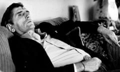 Harry Dean Stanton lying on a sofa