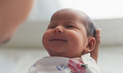 Man holding smiling baby