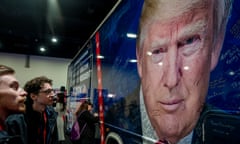 Conference attendees gaze at a poster of former president Donald Trump at the Conservative Political Action Conference on 22 February 2024.