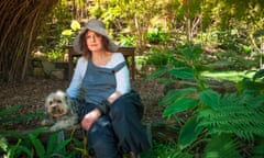 A woman and dog enjoying Wendy Whiteley’s ‘secret garden’ in Sydney’s Lavender Bay.