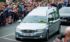 Fans line street as Rob Burrow's hearse passes