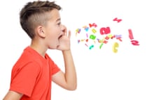 Young boy in bright red T-shirt shouting out alphabet letters