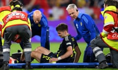 Kieran Tierney is carried on a stretcher during Scotland’s draw with Switzerland.