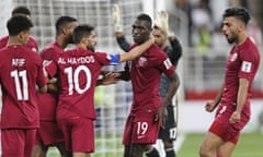 Qatar’s players celebrate after Almoez Ali scored their second goal.