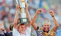 Nelson Mandela celebrates as South Africa’s captain, Neil Tovey, lifts the African Cup of Nations trophy in 1996.