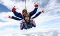 Skydiving photo. Tandem.Tandem jump in the sky with clouds.