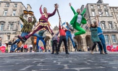 The company Massive Vibe Live! in front of City Chambers on the Royal Mile Edinburgh.