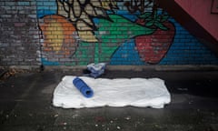 The bedding of a homeless person under a stairwell in Birmingham, England