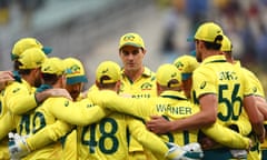 The Australian players form a huddle.
