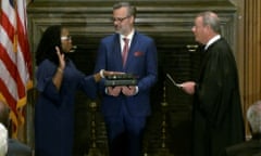 Judge Ketanji Brown Jackson is sworn in as an Associate Justice of the U.S. Supreme Court by Chief Justice John Roberts as Jackson’s husband Patrick Jackson holds the Bible in a framegrab from handout video provided by the U.S. Supreme Court that was broadcast online from the Supreme Court building in Washington, U.S., June 30, 2022. Supreme Court of the United States/Handout via Reuters