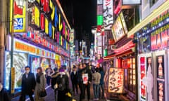 Tourists in Kabukicho district, Shinjuku. Signs in English and English-language menus are becoming more common in the city.