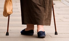 An older woman with walking sticks