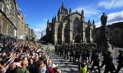 Crowds wait to catch a glimpse of the Queen’s coffin in Edinburgh last week.