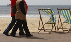 People walking along the seafront.