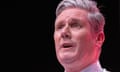 Keir Starmer giving his speech at the Labour conference, with his face shown close up, against a dark background