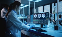 A female scientist working on MRI brain scans.