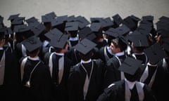 Male students wearing university graduation outfits