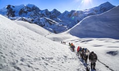 Crossing thorong La Pass, Annapurna circuit, Nepal<br>Trekkers walking on the snow covered trail, trying to cross Thorong (Thorung) La (5416 m/17769 ft), the highest mountain pass in the world, on Annapurna circuit, in Annapurna Conservation Area, Nepal.