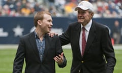 FILE - In this Thursday, Dec. 31, 2009 file photo, former United States President George H. W. Bush, right, leaves the field with the help of Pierce Bush, left, his grandson, before the Texas Bowl NCAA college football game in Houston. Pierce Bush announced Monday, Dec. 9, 2019 that he’ll run in the Republican primary for a congressional seat near Houston. (AP Photo/Dave Einsel, File)