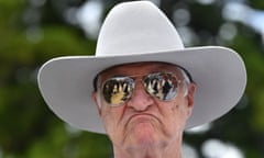A humorous headshot of MP Bob Katter wearing aviator reflector sunglasses and a cowboy hat