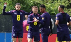 Phil Foden (left) puffs out his cheeks during England training