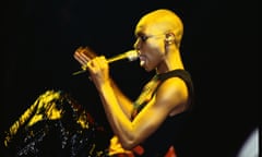 Skin of Skunk Anansie performing at the Glastonbury festival, 1999, in golden light, with glittery trousers