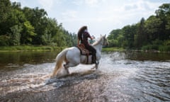 Kiley Knowles rides her horse through the Shell River during a demonstration against the Line 3 pipeline – commonly referred to by activists as the Black Snake.