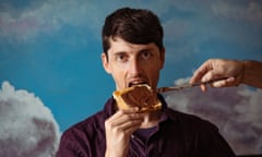 A man biting into a piece of toast spread with chocolate hazelnut spread, against a backdrop of clouds and a blue sky