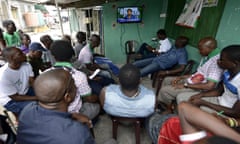 People watching television in Lagos.